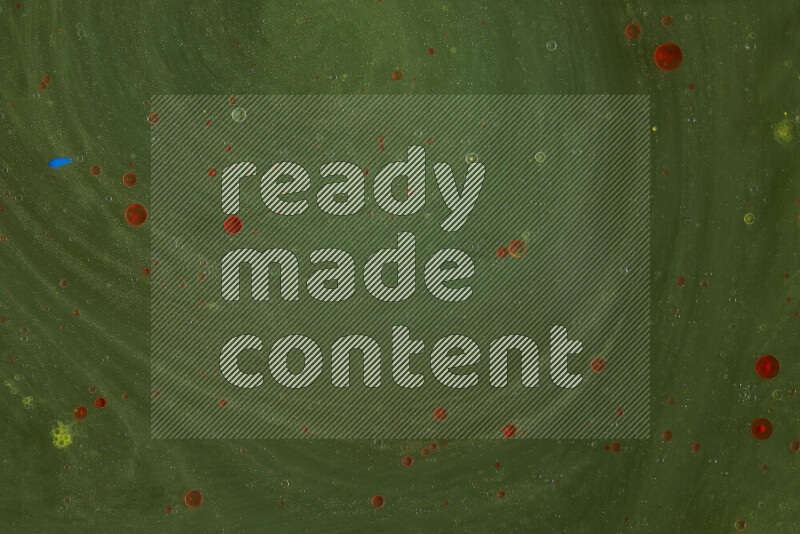 The image captures a dramatic splatter of red paint over a green backdrop