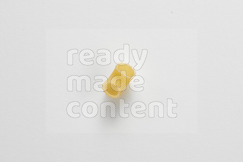 Elbow pasta on white background