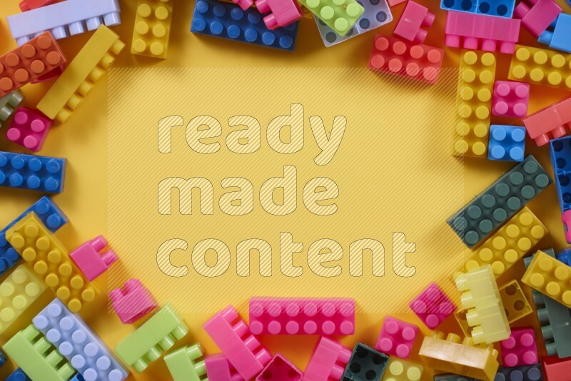 Multicolored plastic building blocks on different backgrounds (kids toys)
