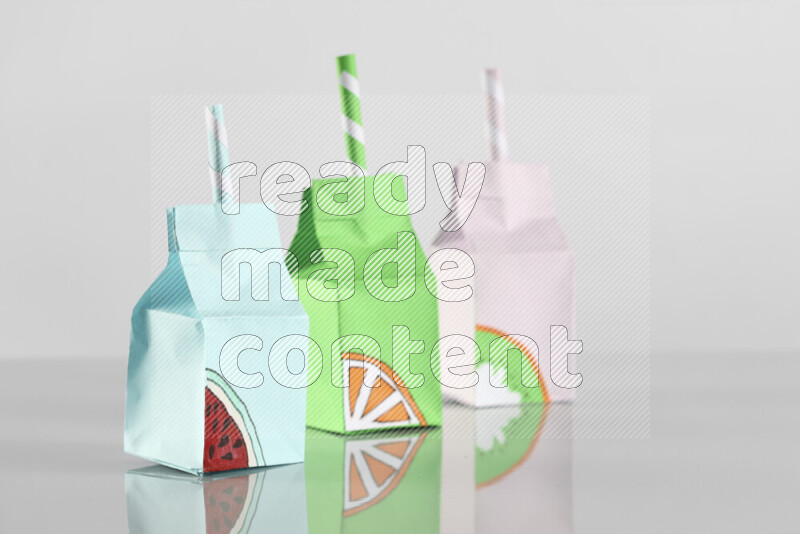 Origami juice box on grey background