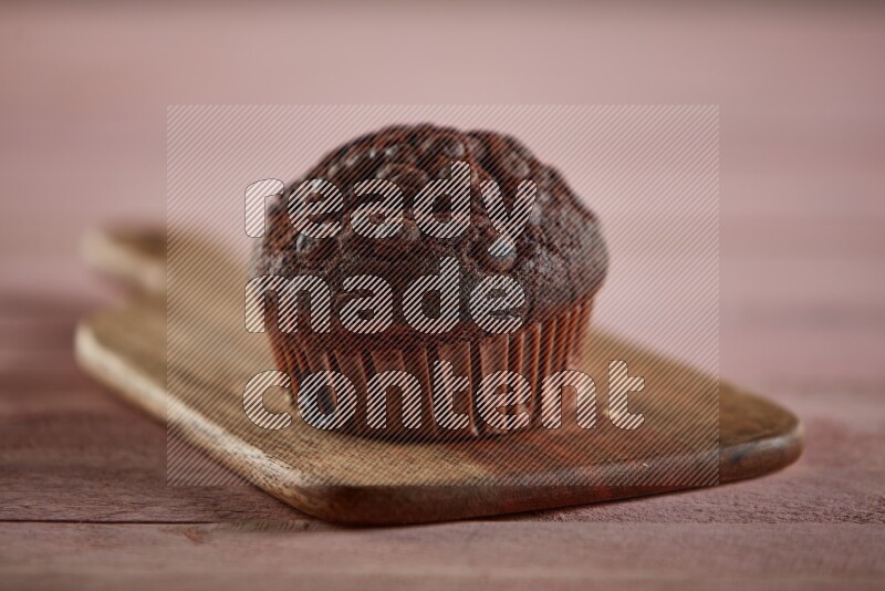 Chocolate cupcake on a wooden board