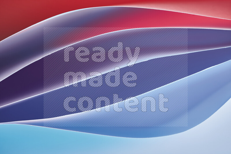 This image showcases an abstract paper art composition with paper curves in blue and red gradients created by colored light