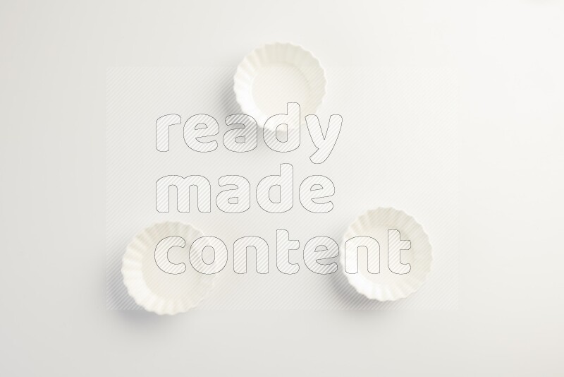 white ceramic round sauce dish on white countertop