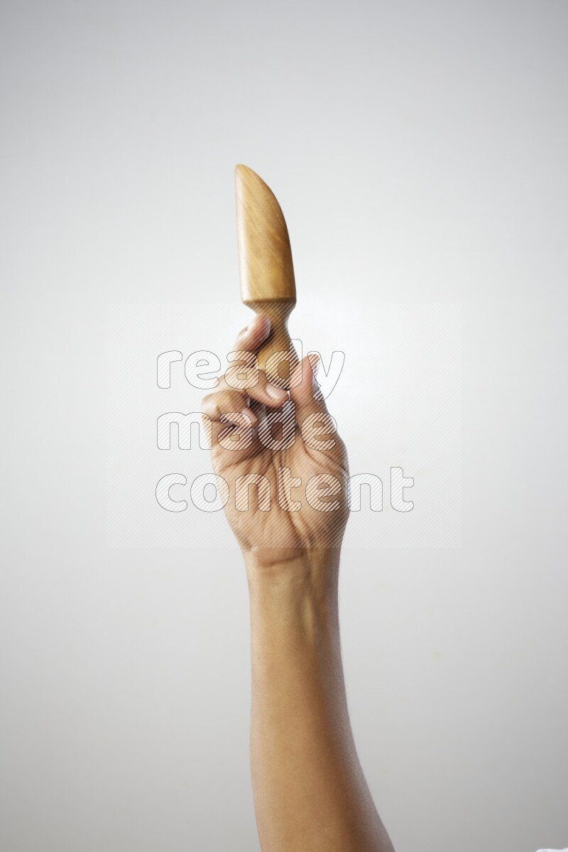 Male Hand Holding Wooden scoop