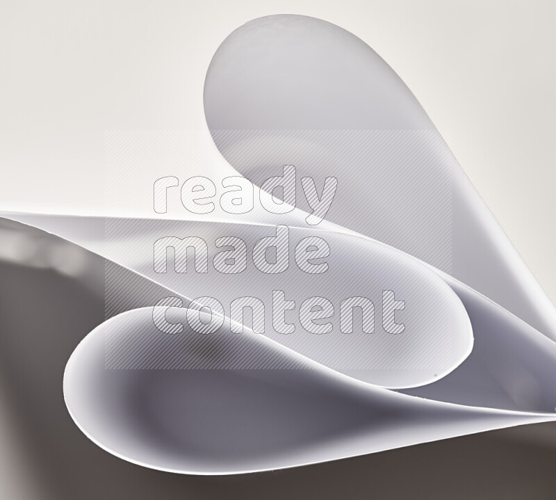 An abstract art of paper folded into smooth curves in grey gradients