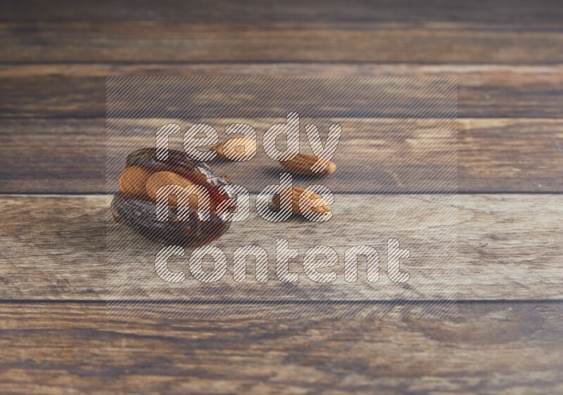 almond stuffed madjoul date on a wooden background