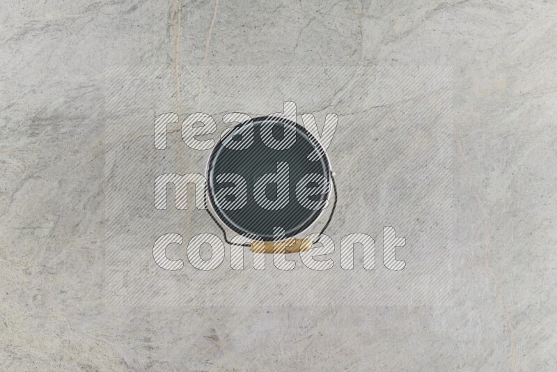 A vintage milk can on grey marble background