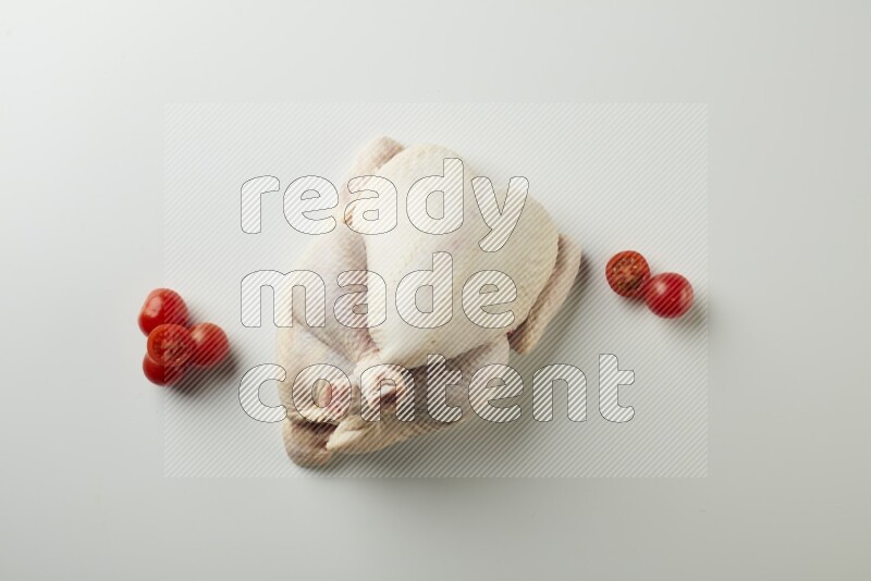 Whole fresh chicken direct on a white background