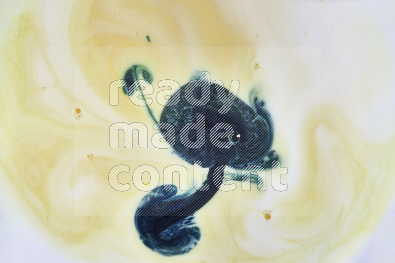 A close-up of abstract swirling patterns in yellow and green