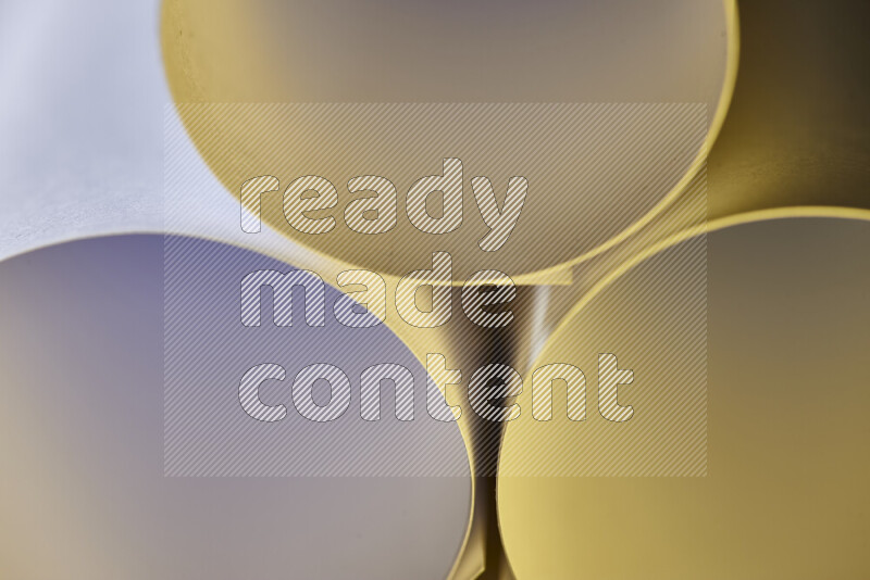 The image shows an abstract paper art with circular shapes in varying shades of grey and warm tones