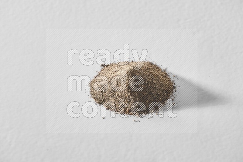 Black pepper powder on a white background