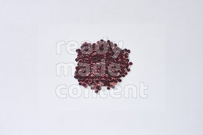 Multicolored flat sequins on grey background