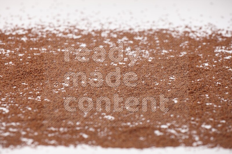 Garden cress seeds spread on a white flooring