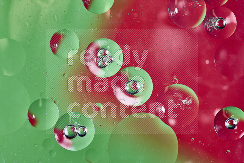 Close-ups of abstract oil bubbles on water surface in shades of green and red