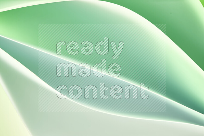 This image showcases an abstract paper art composition with paper curves in green and white gradients created by colored light