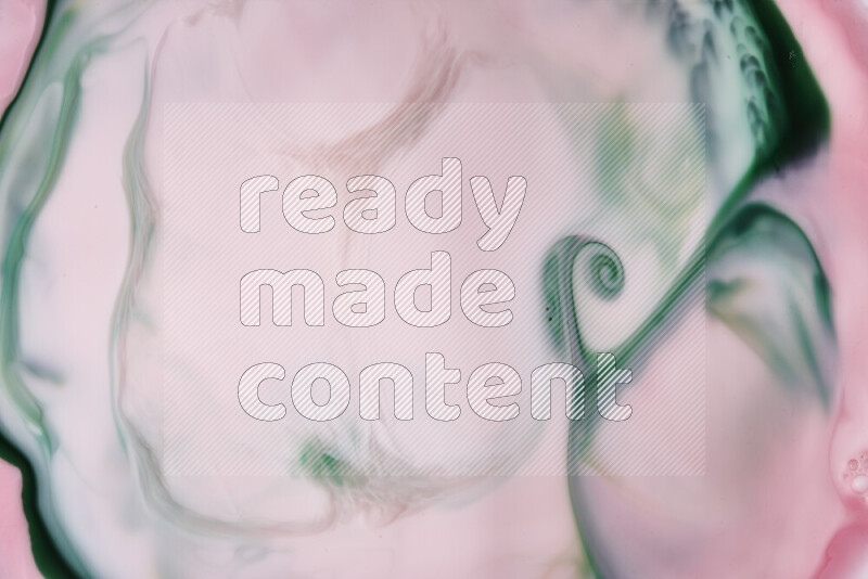 A close-up of abstract swirling patterns in red and green