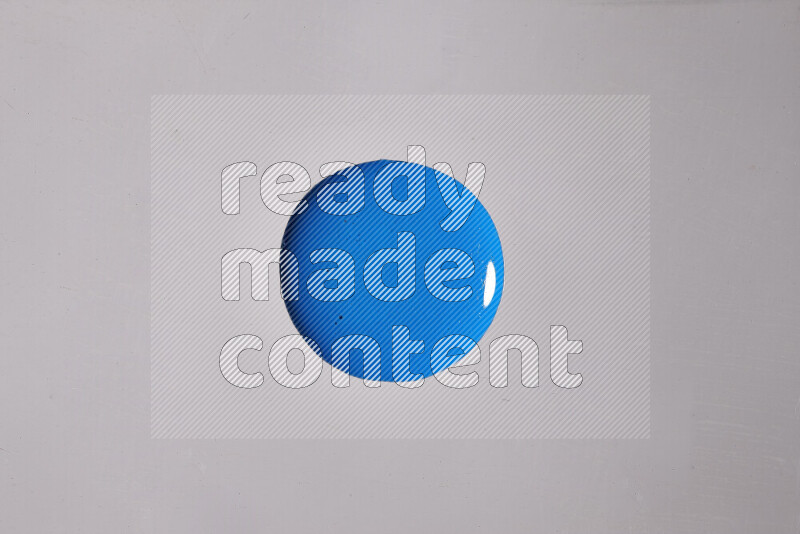 Close-ups of assorted colors blending on a grey background