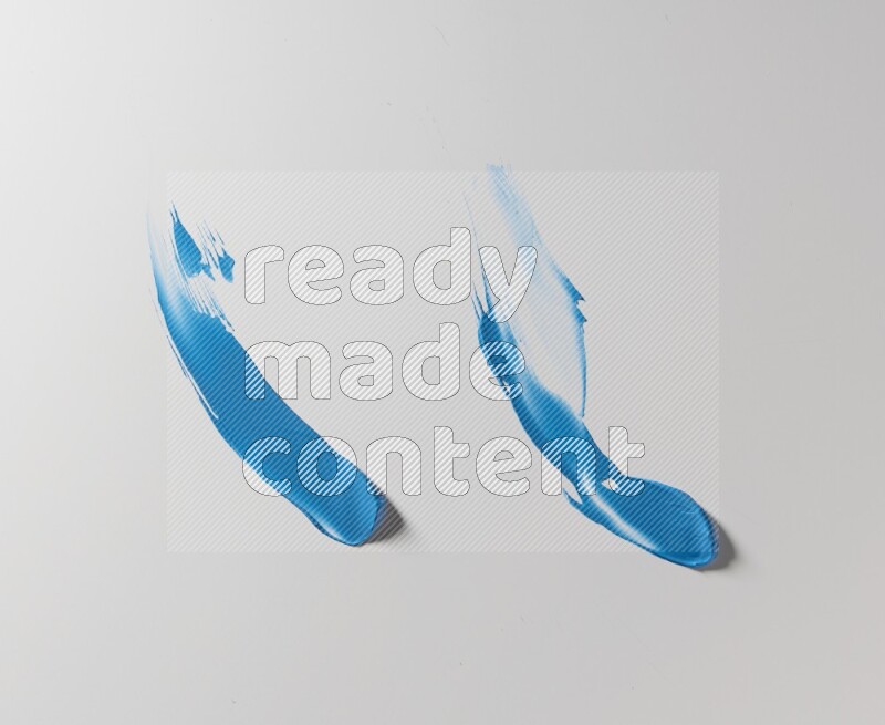 Blue curved painting knife strokes on white background