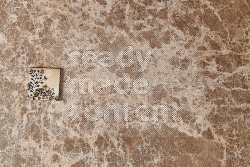 A decorative coaster on beige marble background