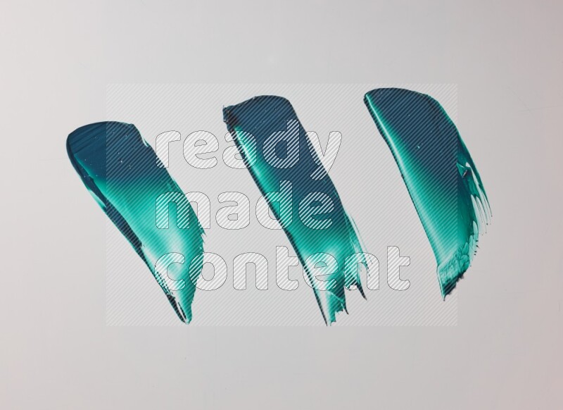 Turquoise painting knife strokes on white background