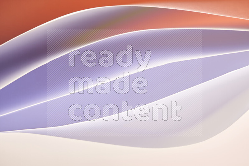 This image showcases an abstract paper art composition with paper curves in white and different warm gradients created by colored light