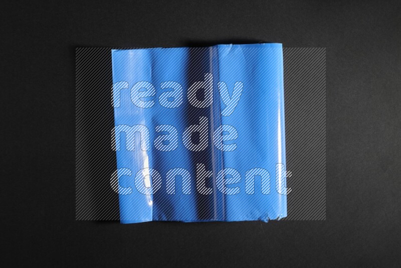 Colored plastic textures on black background