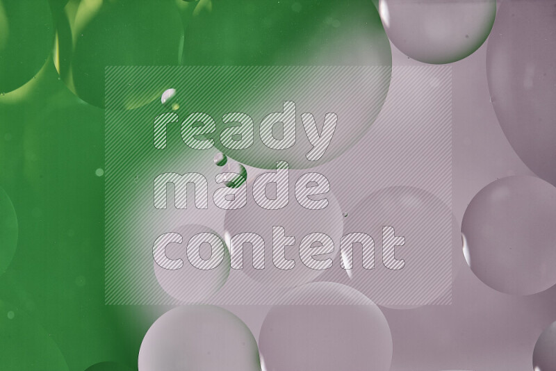 Close-ups of abstract oil bubbles on water surface in shades of white and green