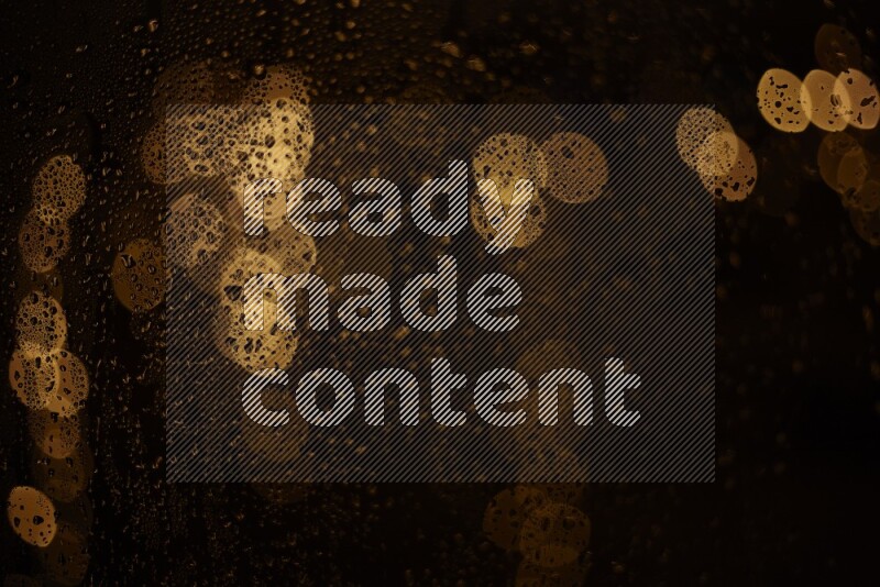 Bokeh light in yellow with water drops