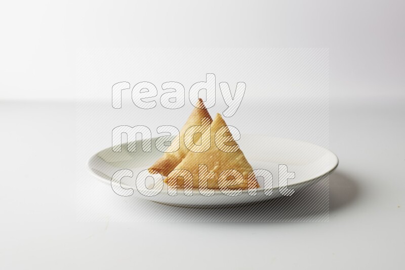 sambosas on a white background