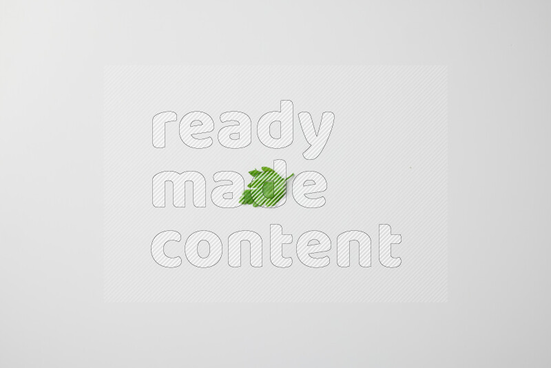 Scattered fresh parsley leaves on white background