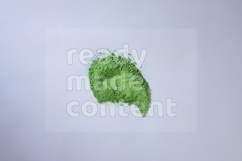 Green powder smears on white background
