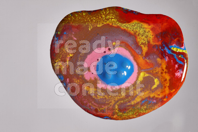 Close-ups of assorted colors blending on a grey background