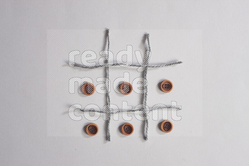 Wooden buttons placed on grey background