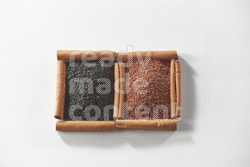 2 squares of cinnamon sticks full of black seeds and garden cress on white flooring