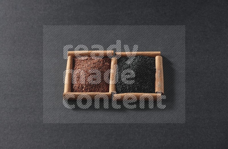 2 squares of cinnamon sticks full of garden cress and black seeds on black flooring