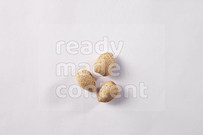 Almonds on white background