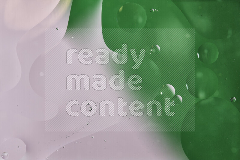 Close-ups of abstract oil bubbles on water surface in shades of white and green