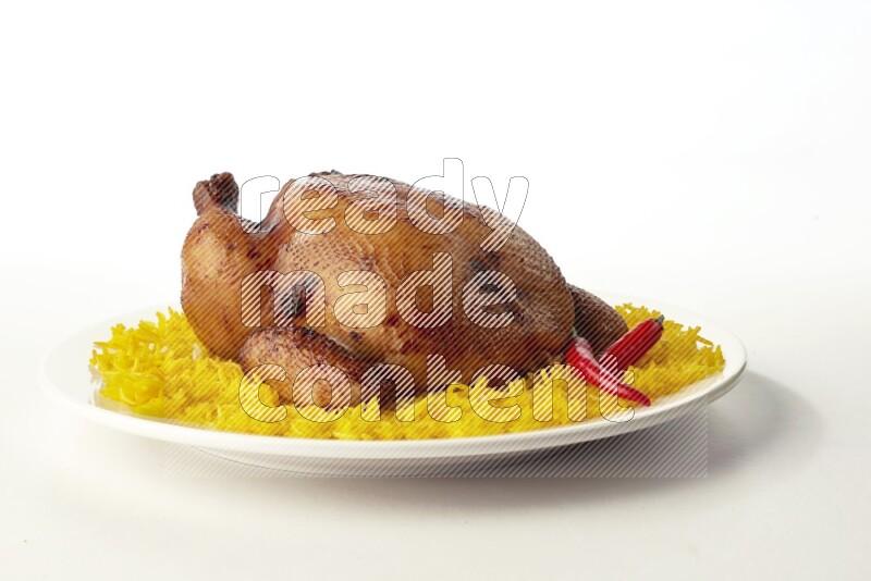 yellow  basmati Rice with  whole roasted chicken on a white rounded plate direct on white background