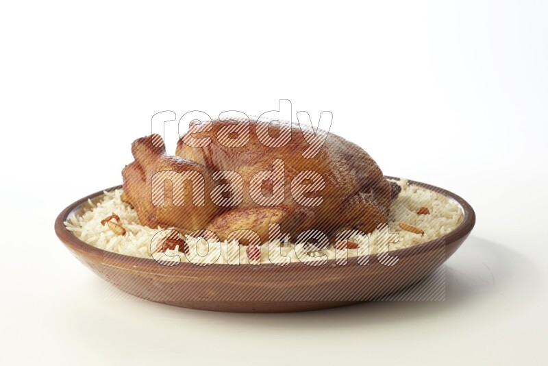 white  basmati Rice with  whole roasted chicken    on a pottery plate  direct  on white background
