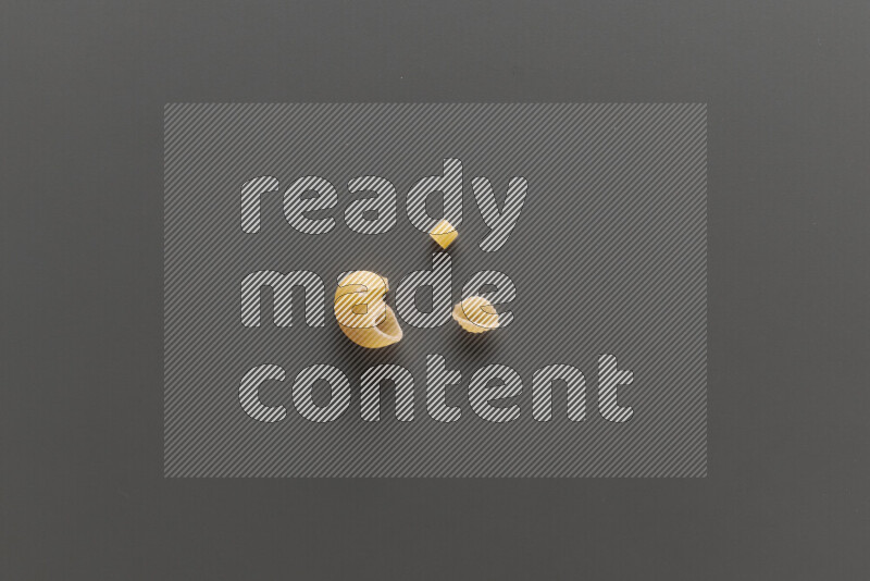 Different pasta types on grey background