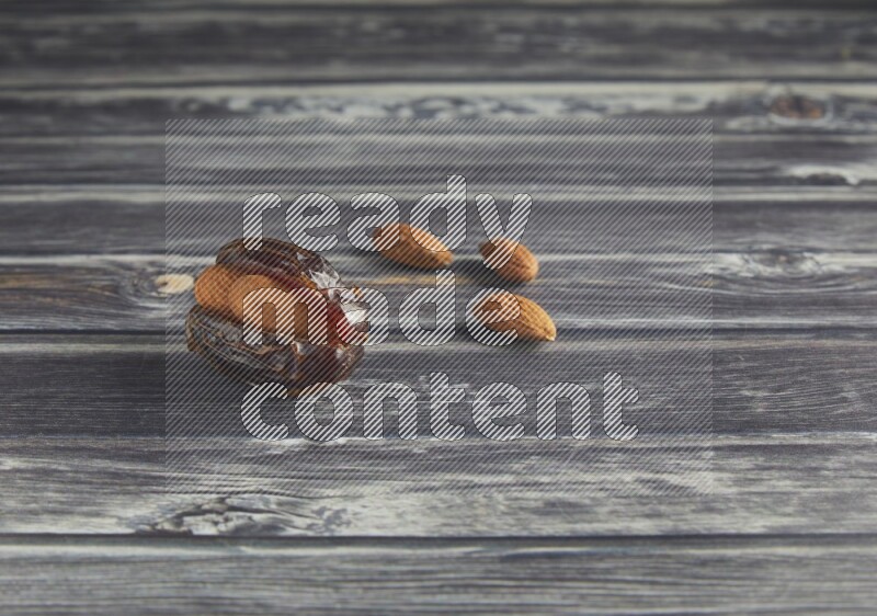 almond stuffed madjoul date on a wooden grey background