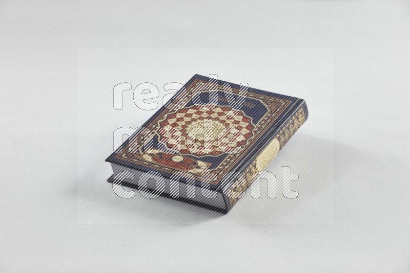 Quran with a prayer beads on white background