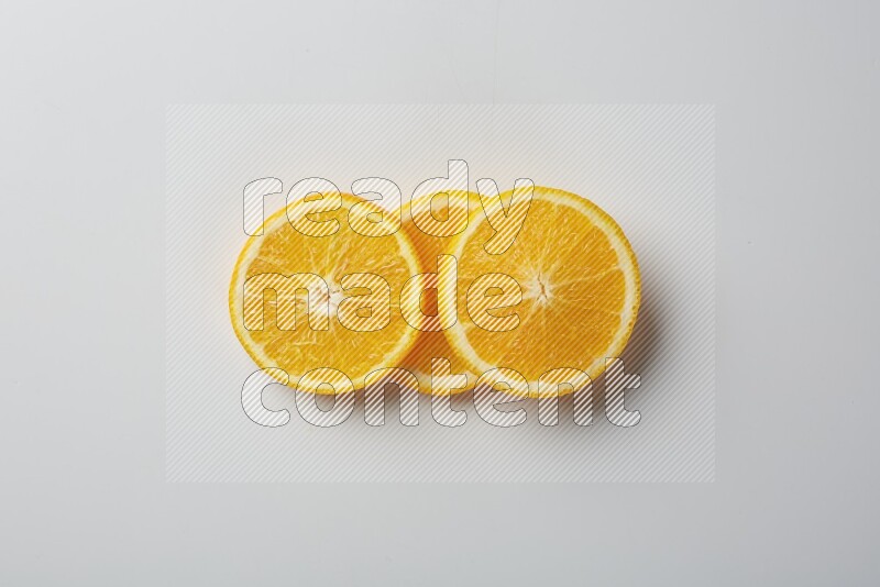 Three orange slices on a white background