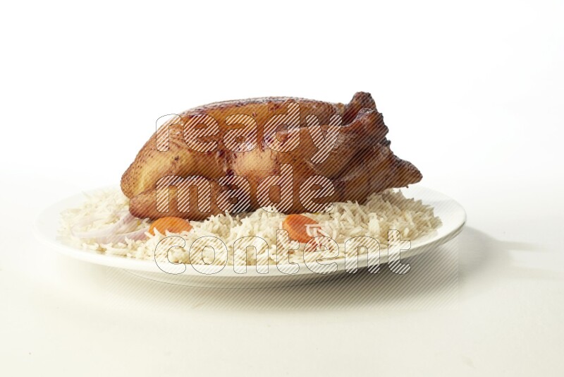 white  basmati Rice with  whole roasted chicken  on a white rounded plate direct on white background
