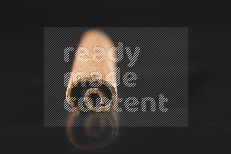 Cinnamon sticks on black background