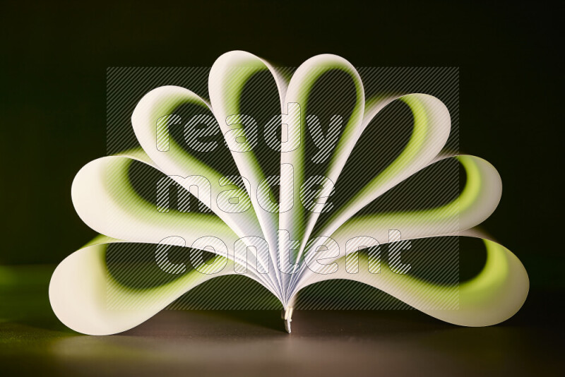 An abstract art piece displaying smooth curves in green and white gradients created by colored light