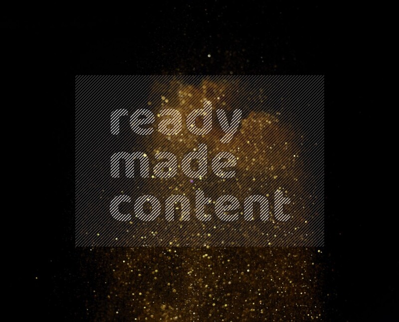 Gold glitter powder isolated on black background