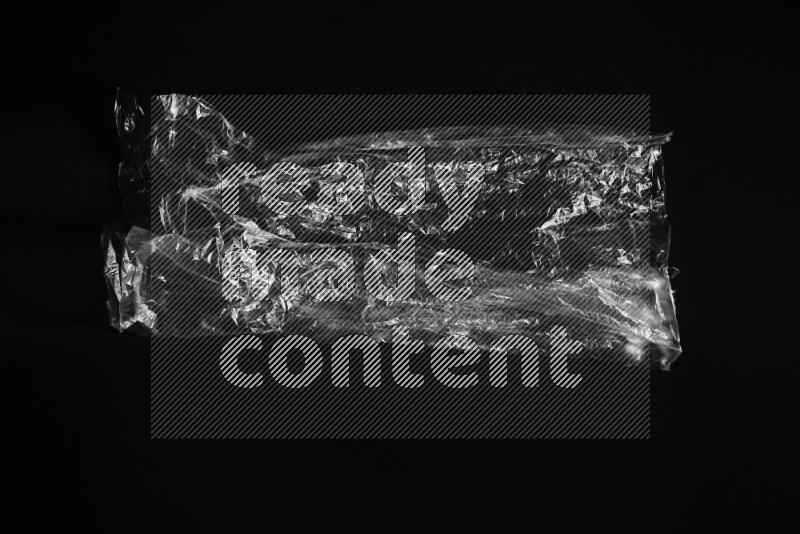 Transparent plastic textures on black background