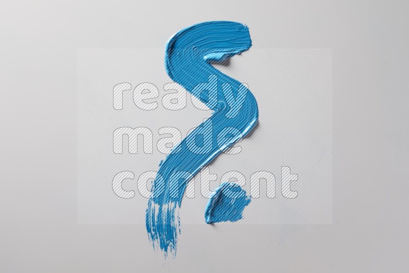 A single blue zigzag brush stroke on a white background