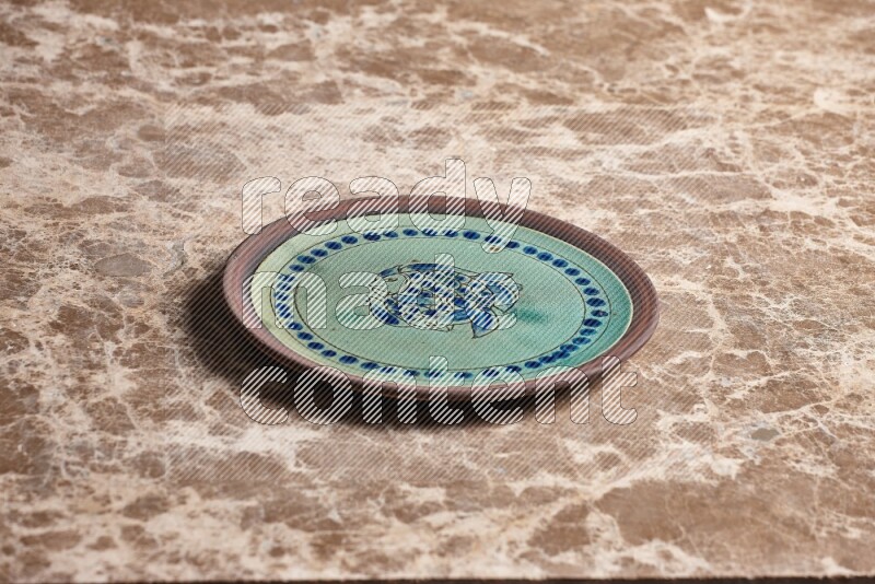Decorative Pottery Plate on Beige Marble Flooring